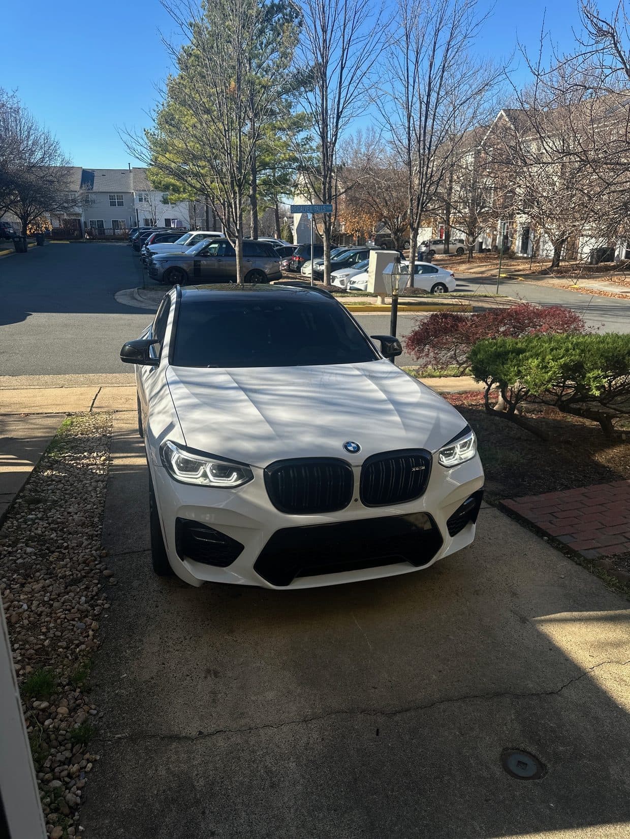 BMW X3 SUV in driveway, BMW service DMV