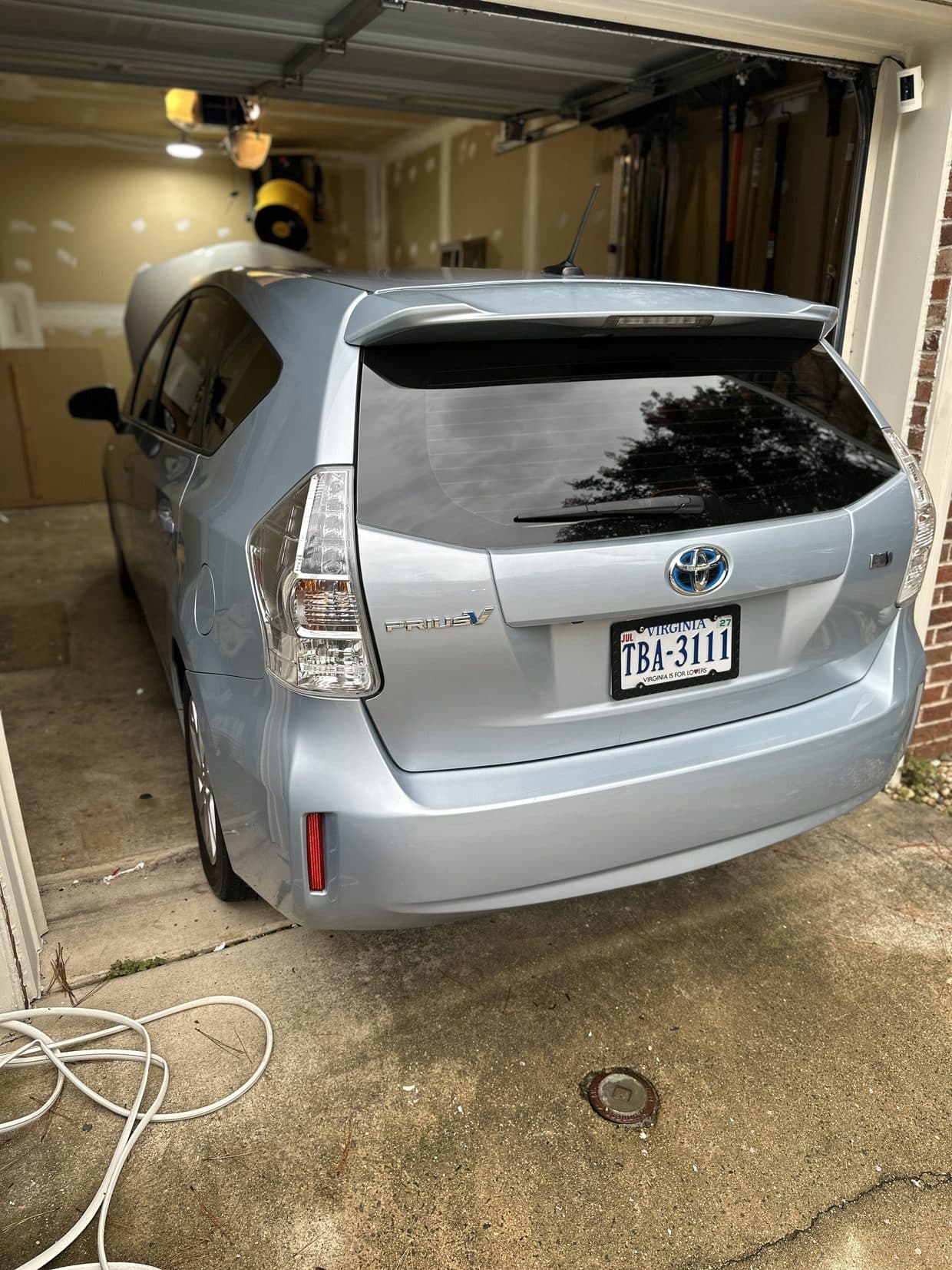 Silver Toyota Prius rear in driveway, Toyota maintenance Sterling VA
