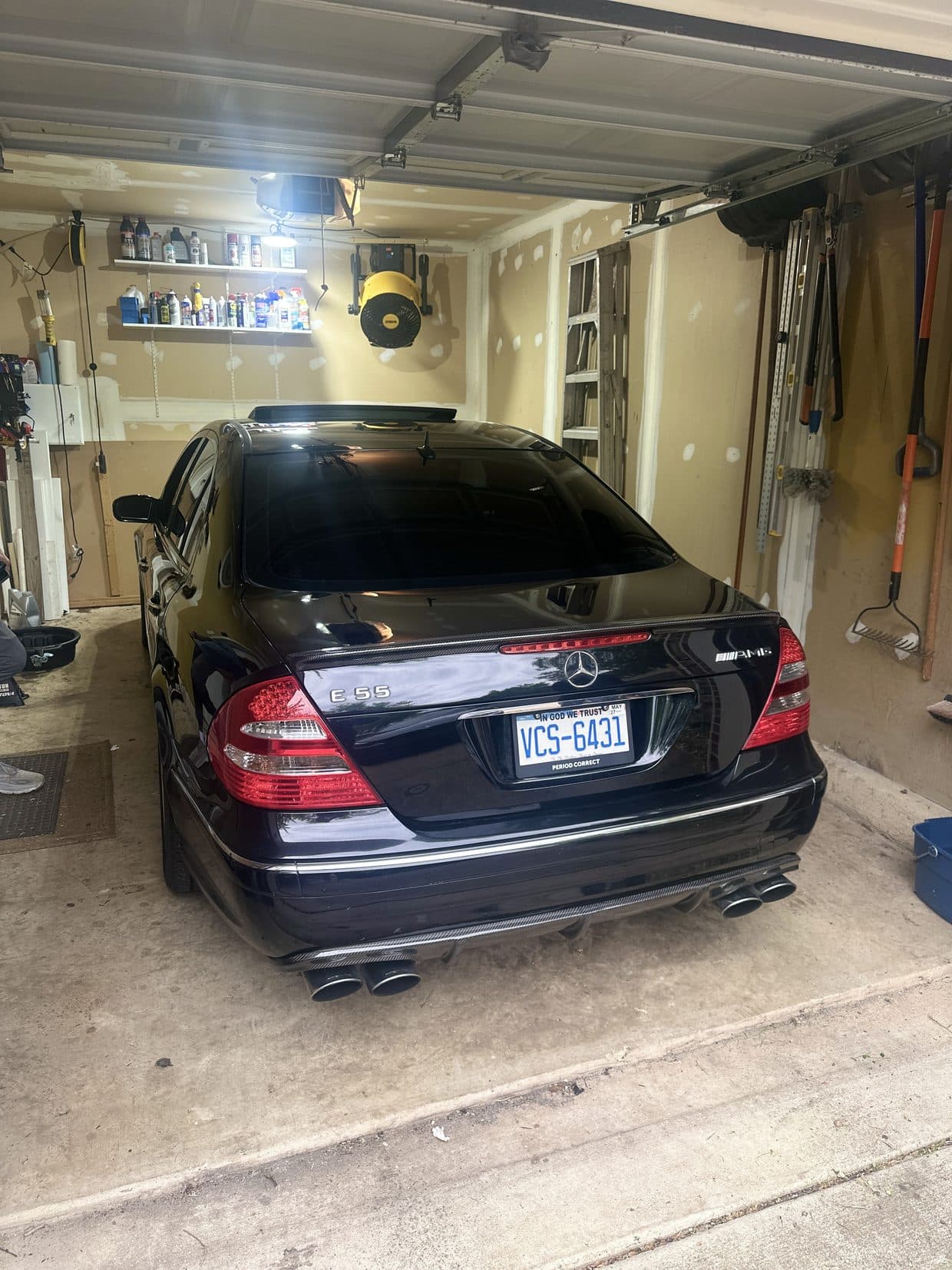 Black Mercedes-Benz sedan rear in garage, Mercedes repair DMV