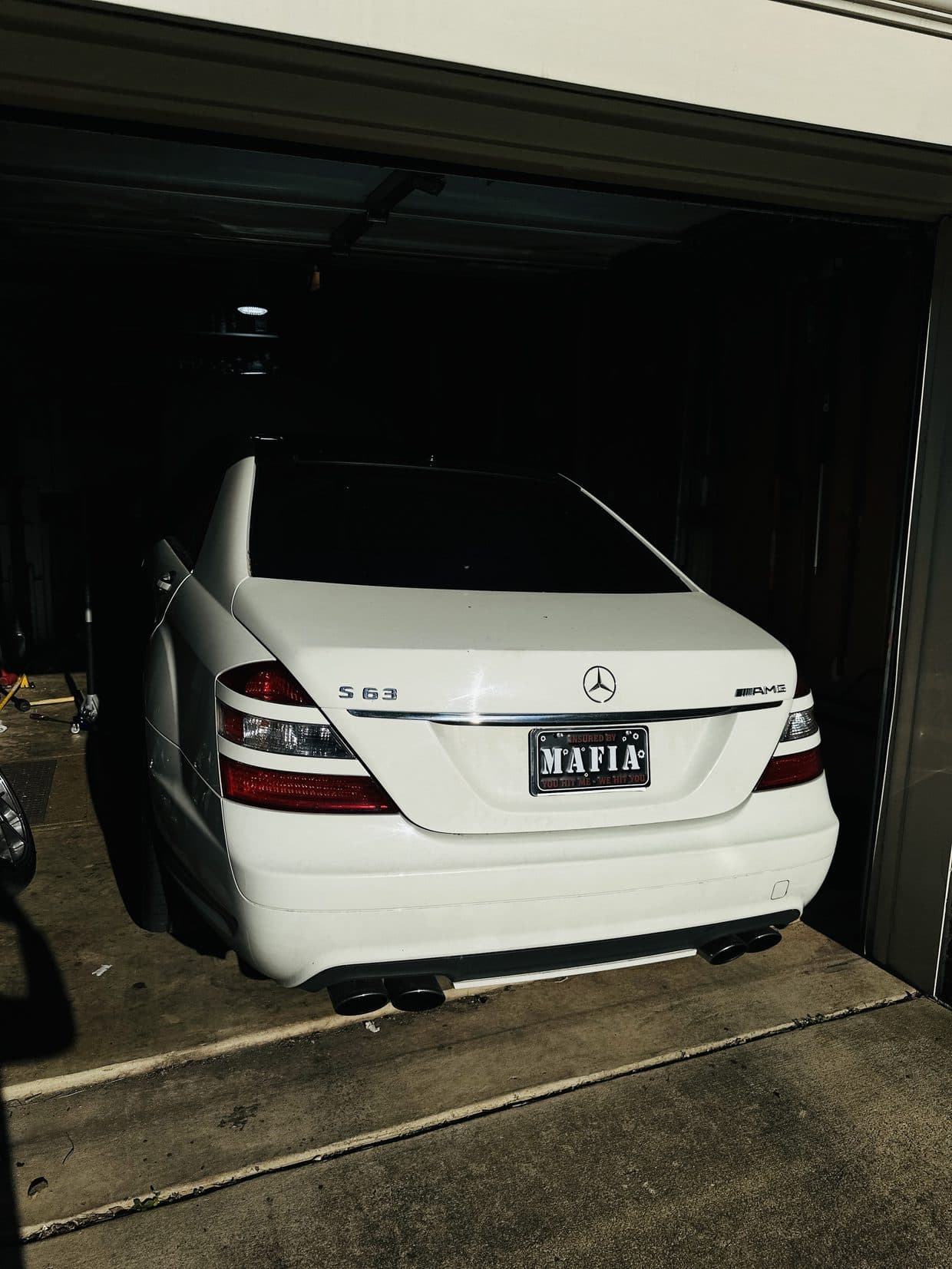 White Mercedes-Benz E-Class sedan rear in garage, Mercedes repair Sterling VA