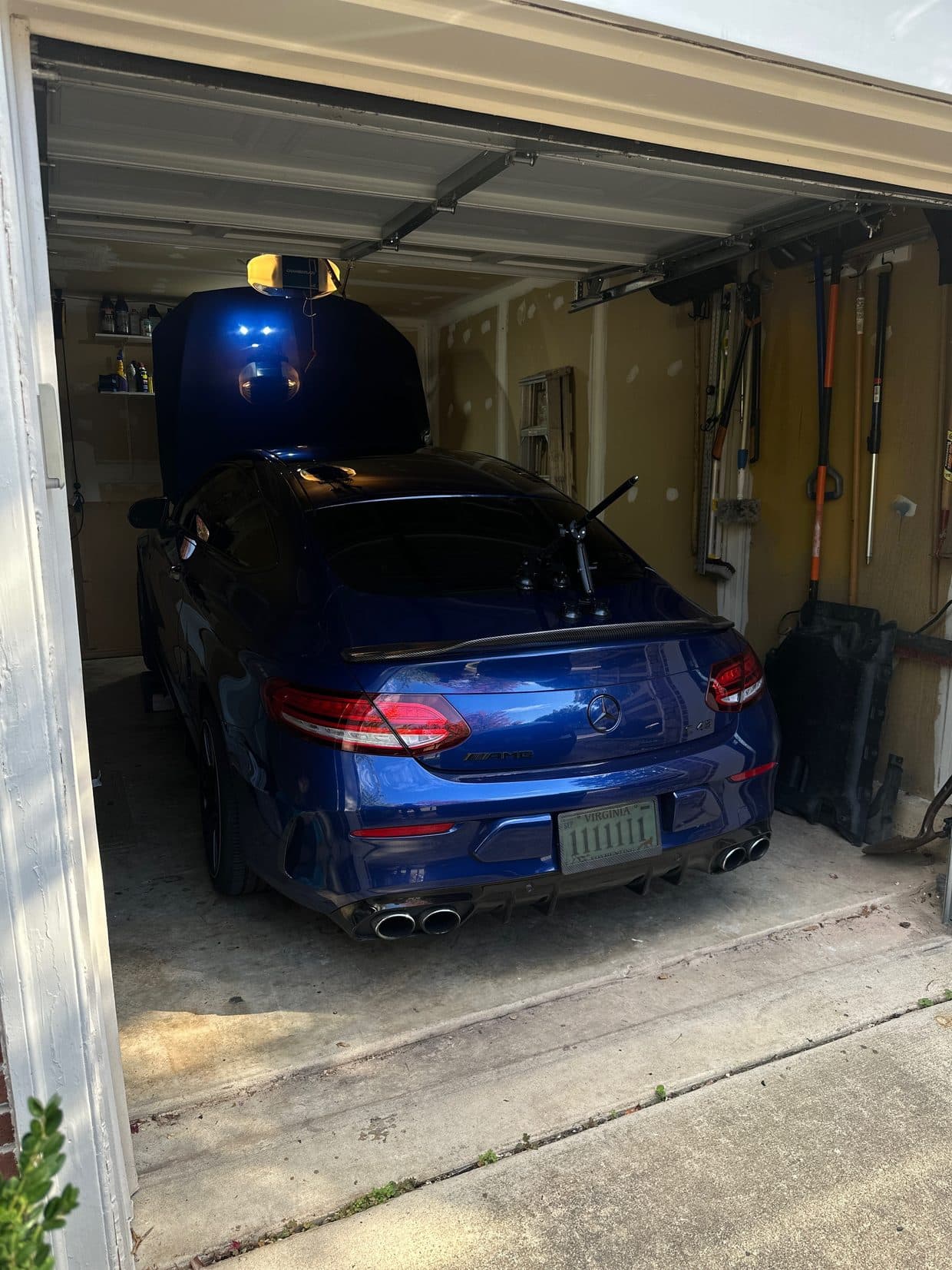 Blue BMW M-series rear in shop garage, BMW service Northern Virginia