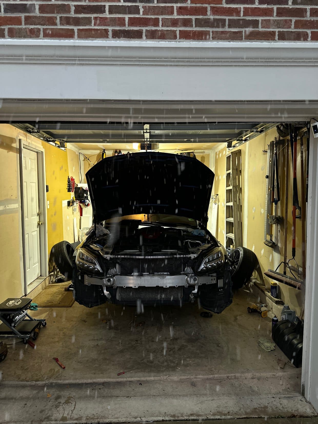 Front-end teardown in shop bay, German auto repair Sterling VA
