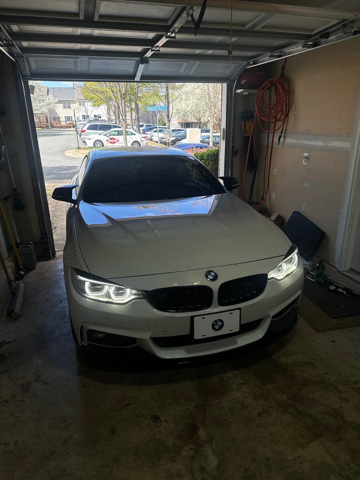 White BMW 3 Series front three-quarter in driveway, BMW service DMV
