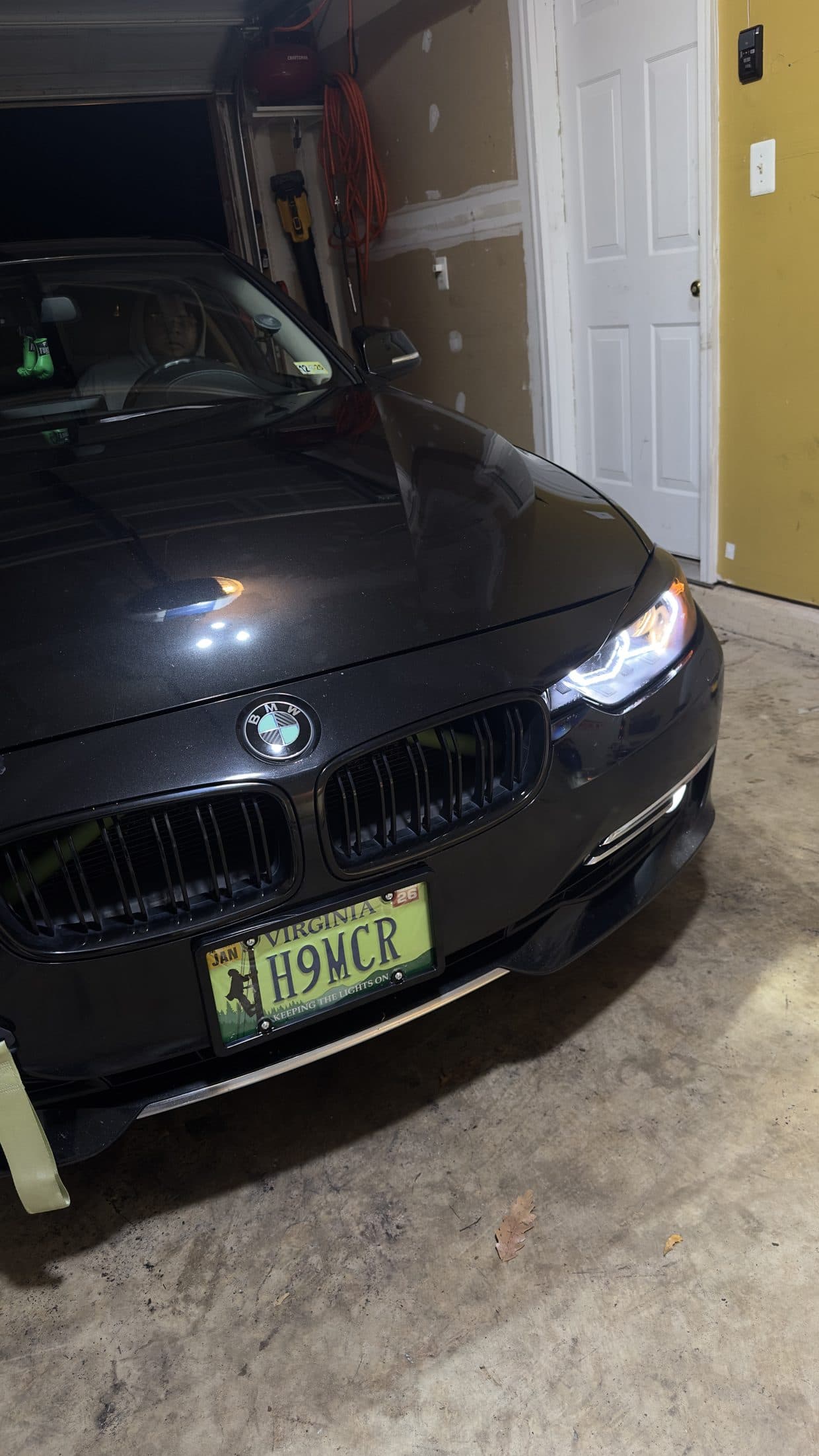 Black BMW coupe front three-quarter in driveway, BMW service DMV