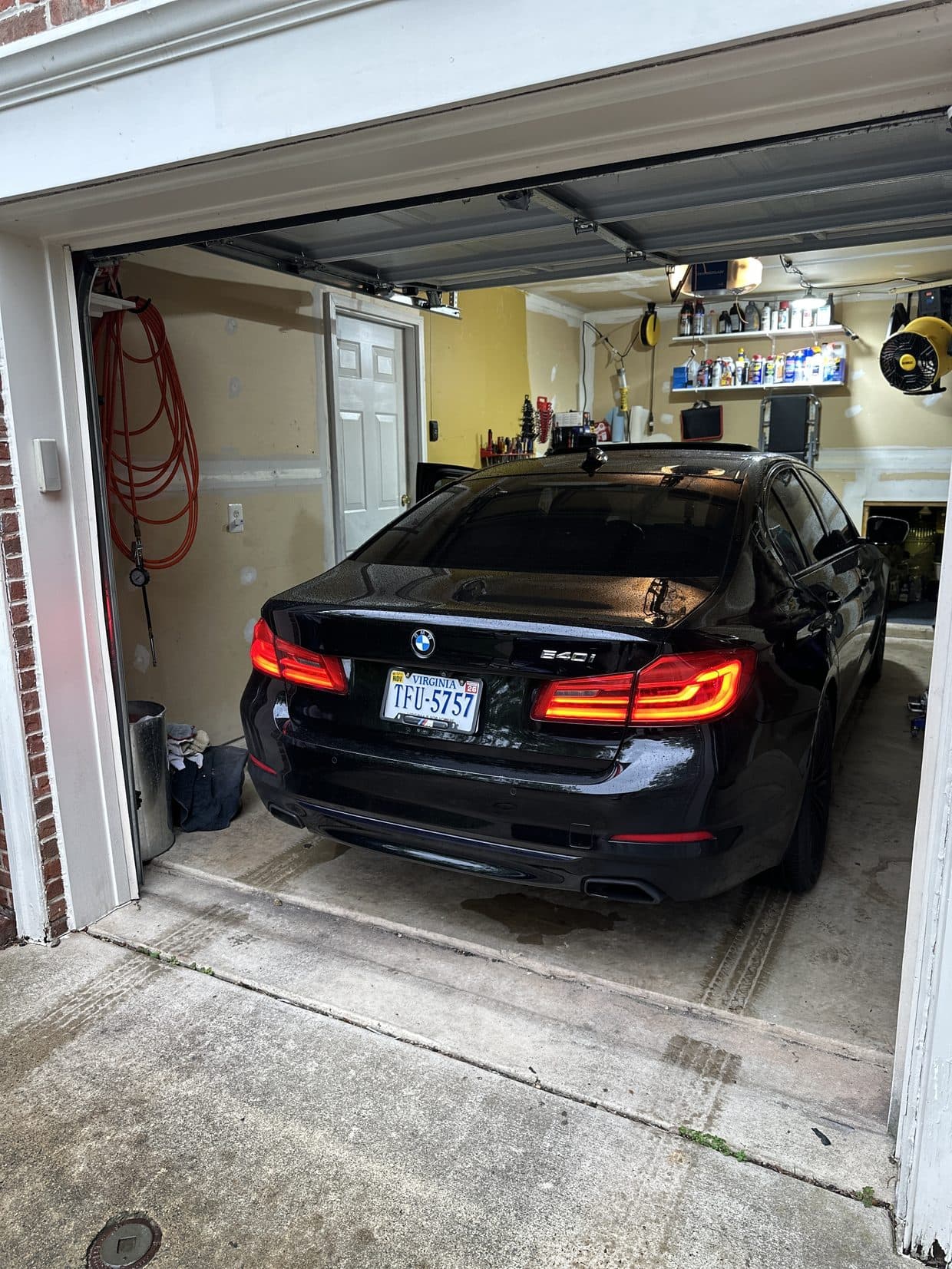 Black BMW 5 Series rear in garage, BMW repair Northern Virginia