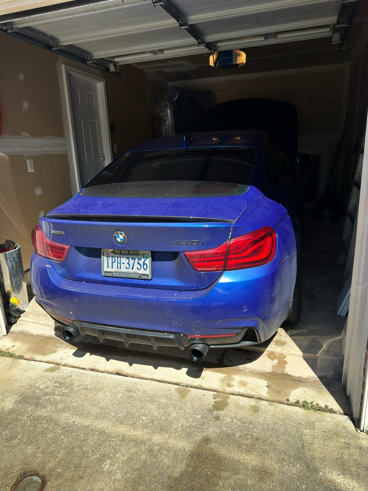 Bright blue BMW M-series rear in garage, BMW performance DMV