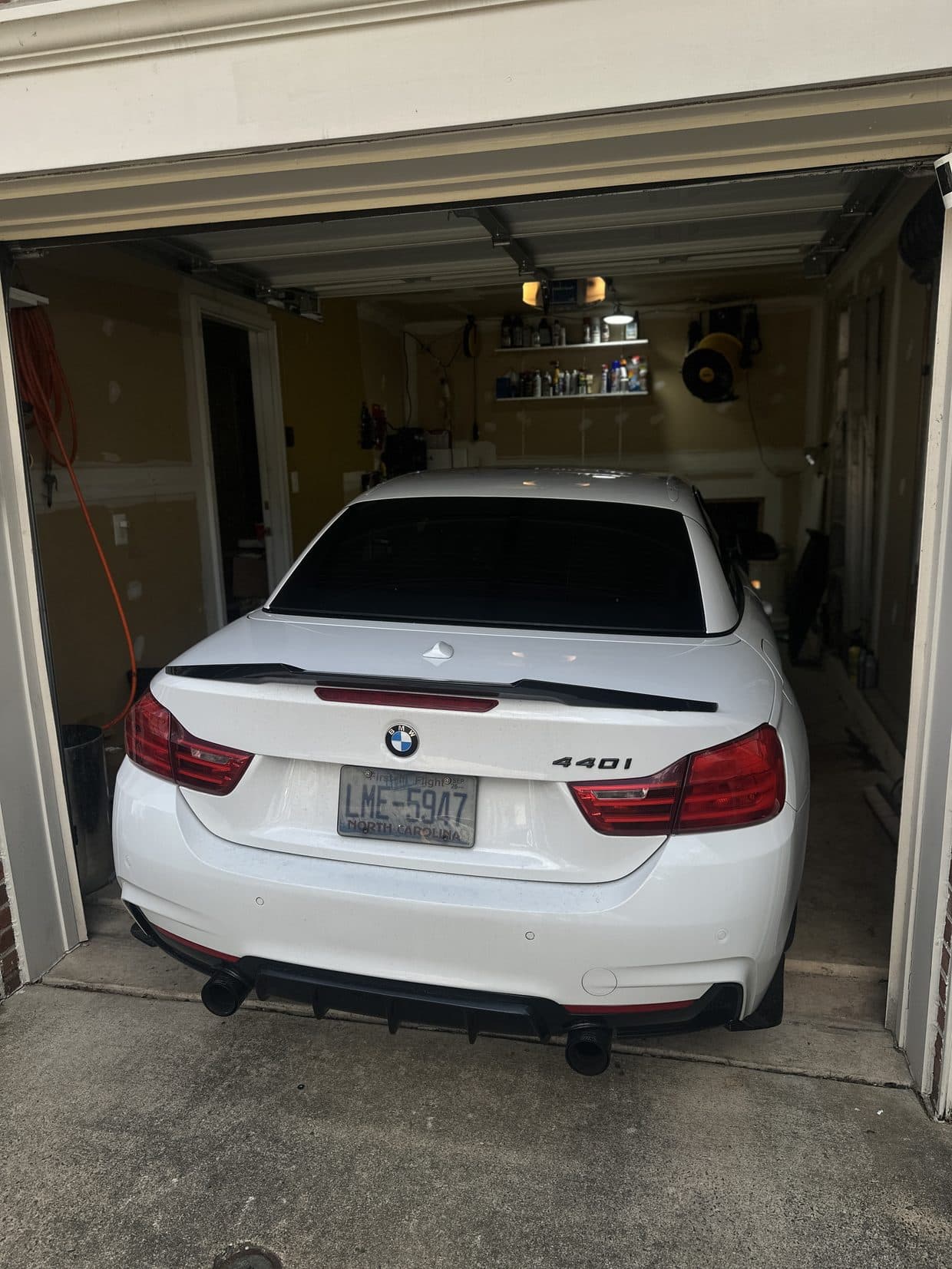 White BMW rear in shop garage, BMW service Northern Virginia