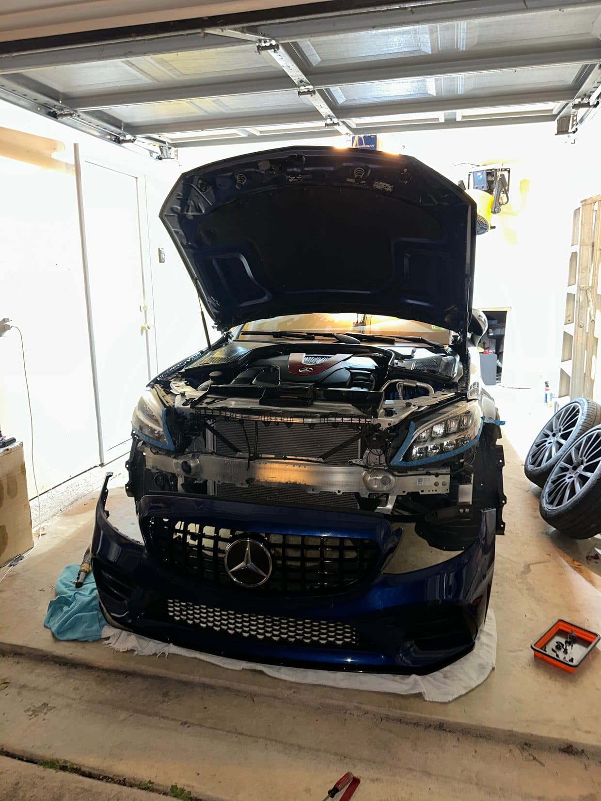 Black Mercedes-Benz front with hood up in bay, Mercedes repair Sterling VA