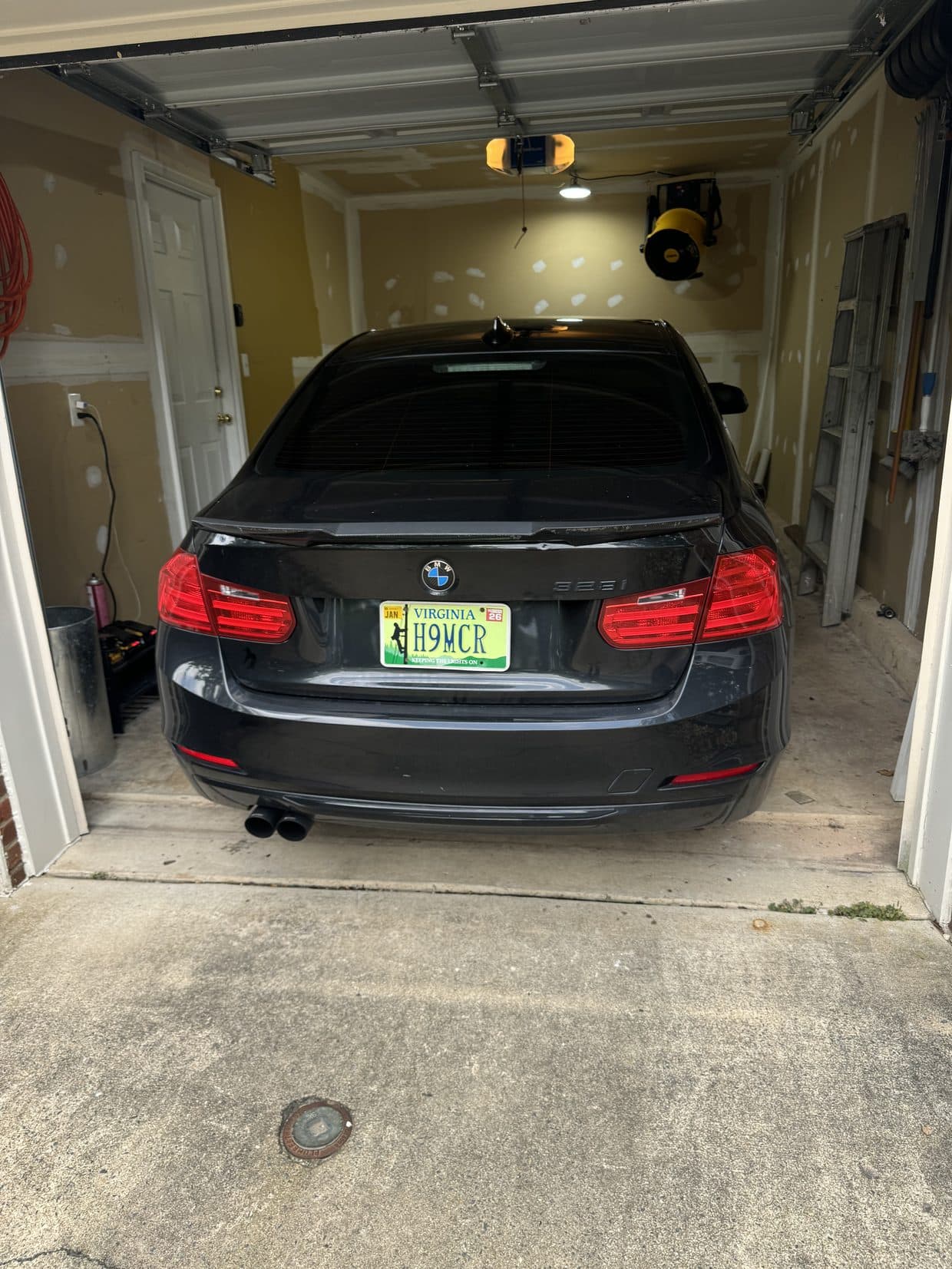 BMW 3 Series rear in shop garage, BMW service DMV
