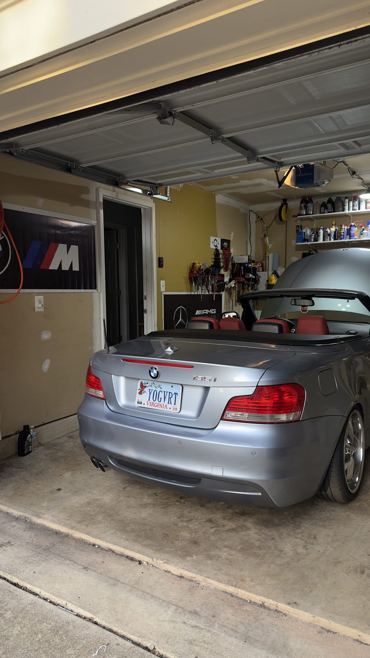 Silver BMW 3 Series convertible rear in garage, BMW service DMV