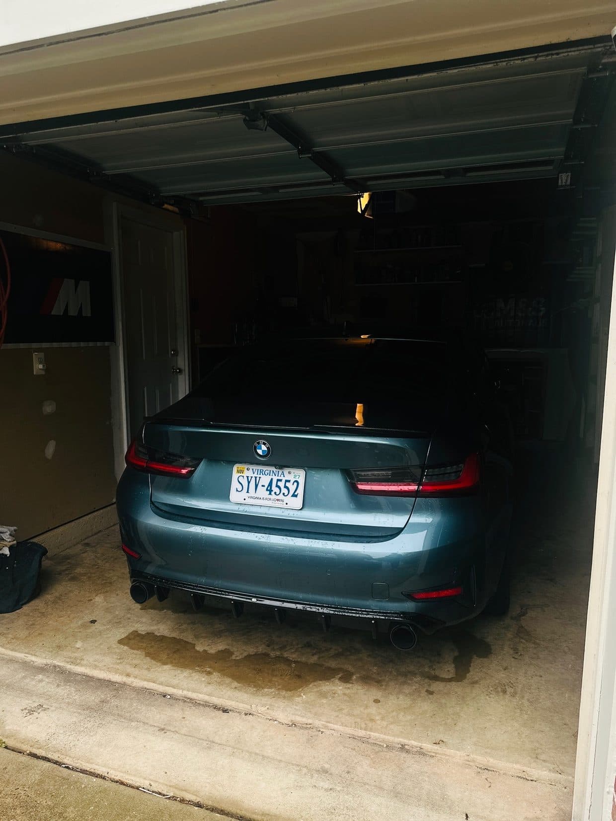 Teal BMW sedan in shop garage, BMW repair Northern Virginia
