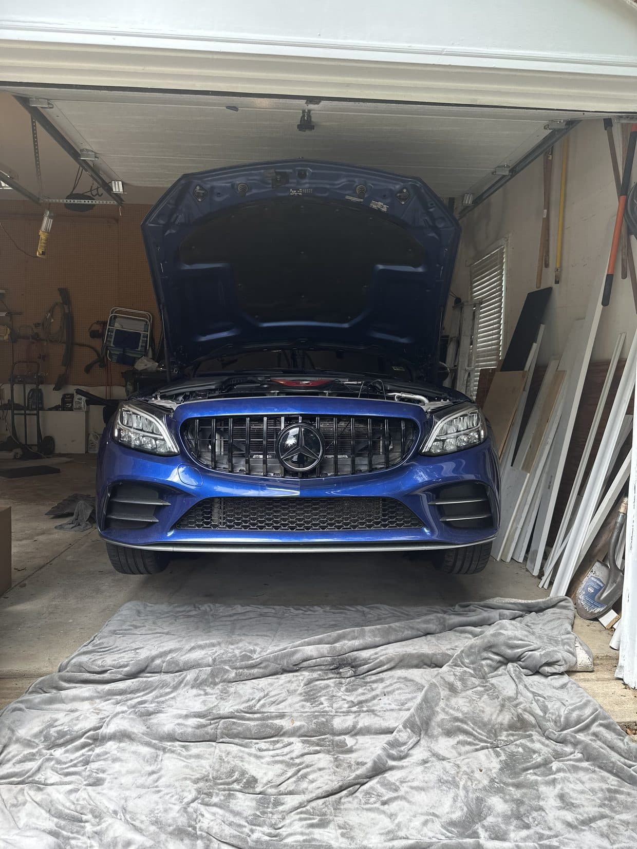 Blue Mercedes-AMG C43 Coupe with OEM GT-style Panamericana vertical-bar grille installed