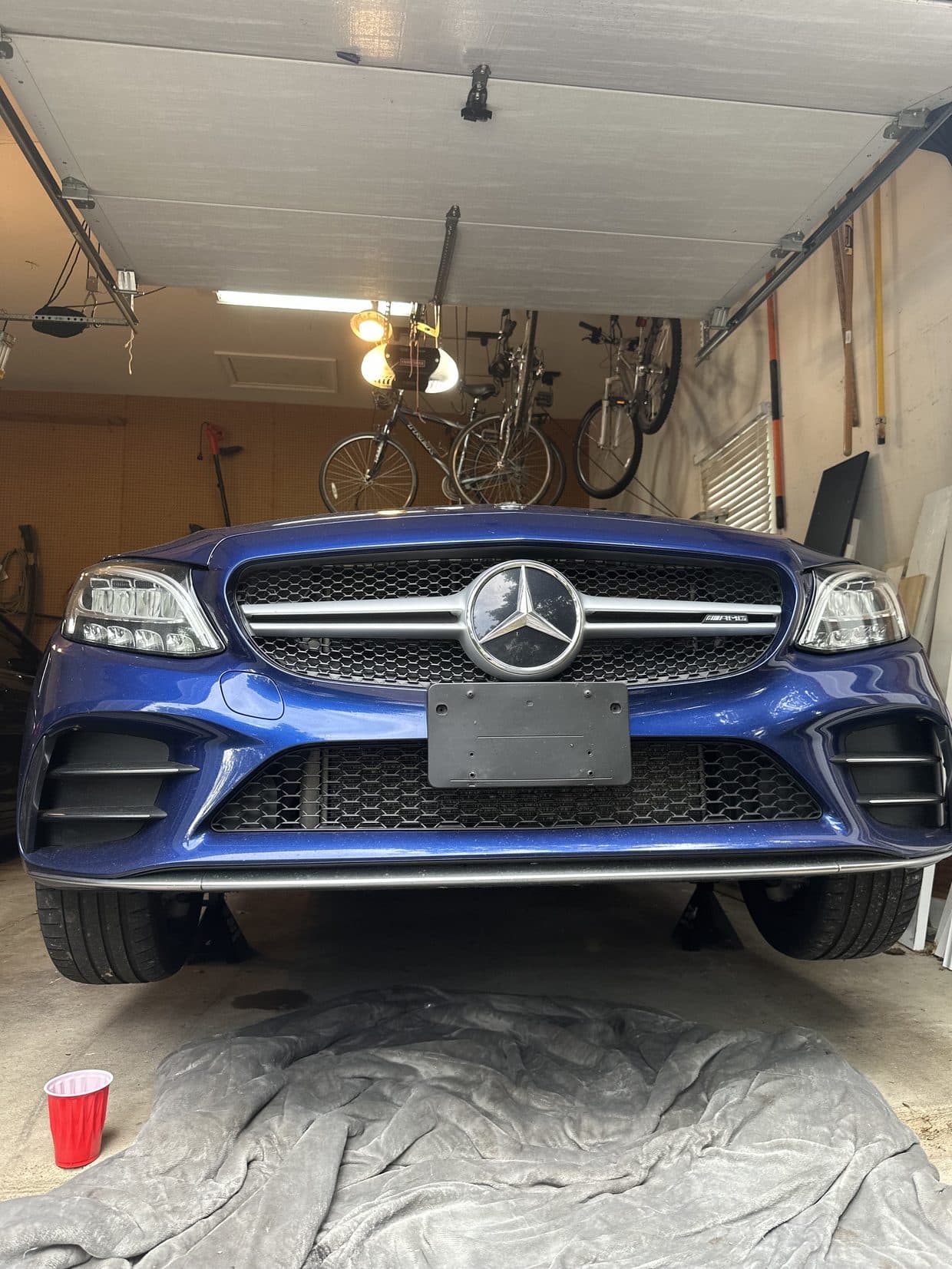 Blue Mercedes-AMG C43 Coupe with factory single-bar silver-chrome grille